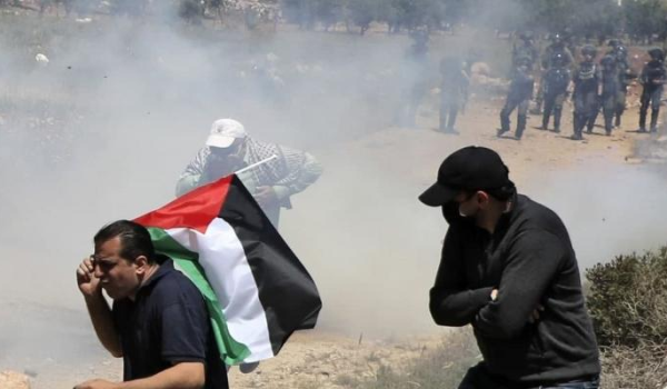 Youth shot and injured, dozens suffocate as Israeli forces quell Beit-Dajan anti-settlemen...